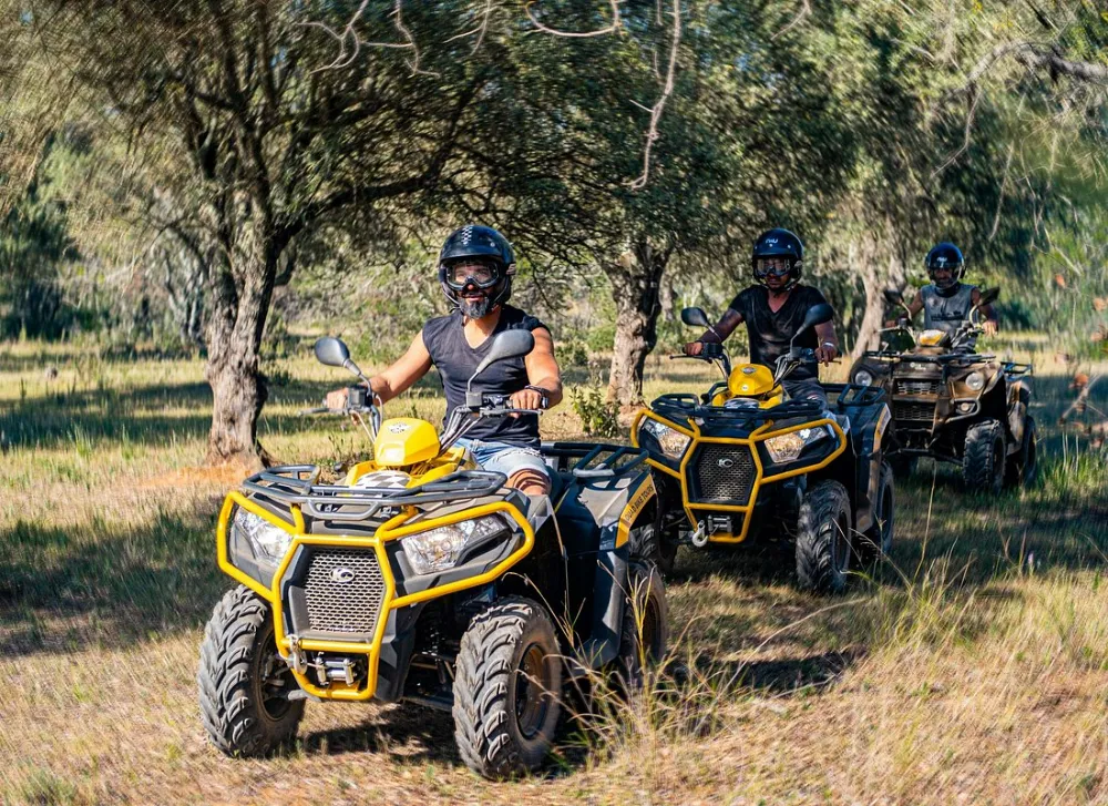 Quad bike tackling a steep dirt climb
