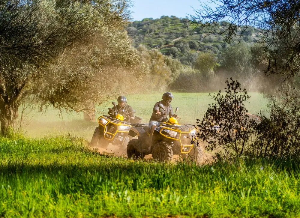 Quad bike tackling a dirt trail in the Algarve countryside
